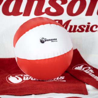 A red and white beach ball with a towel on it.