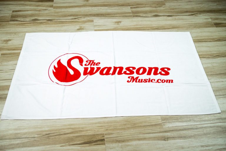 The swansons music logo on a white towel.