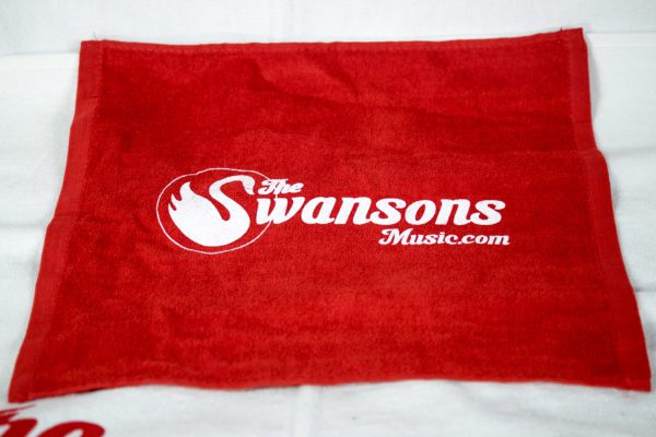 A red towel with the swansons logo on it.