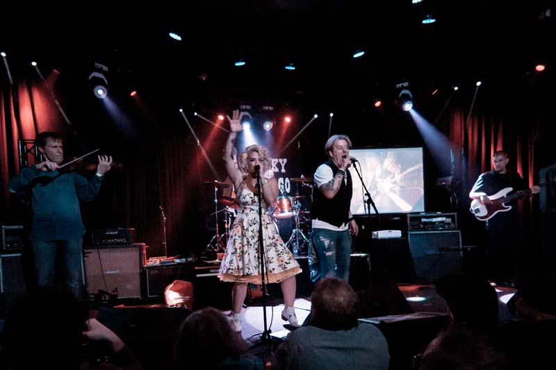 A woman singing on stage