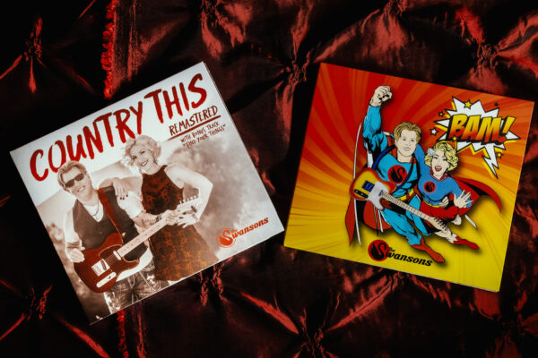 Two COMBO CD's 'Bam' & 'Country This Remastered' with country this and superman on them.