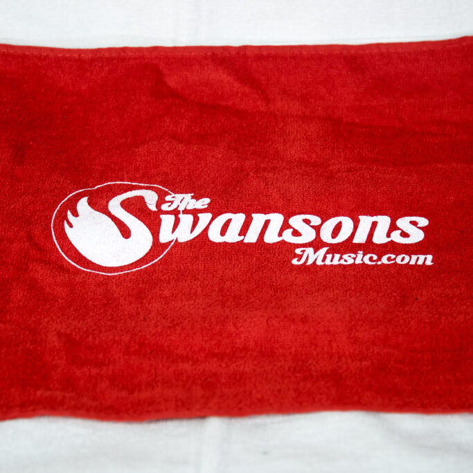 A red towel with the swansons logo on it.